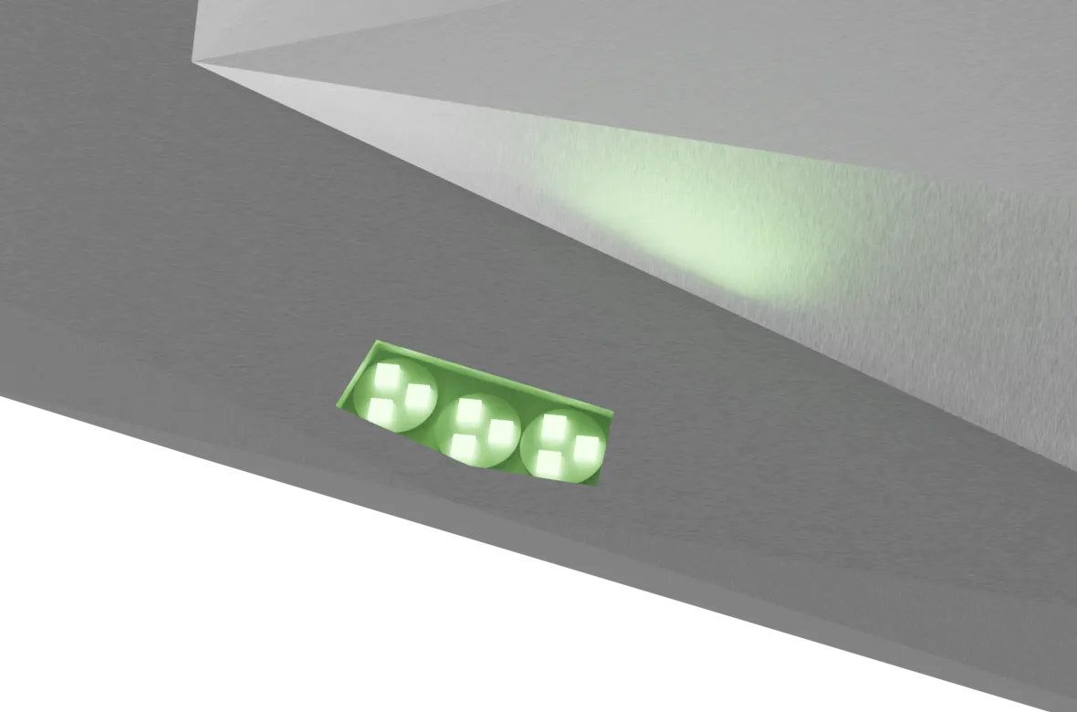 Close-up render of a recessed LED module on Mobula's hull: three green emitters on a green board, throwing a cone of light across the faceted plating